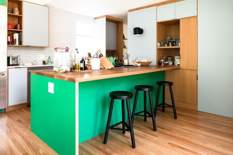 two-tone kitchen color idea with green and light green cabinetry