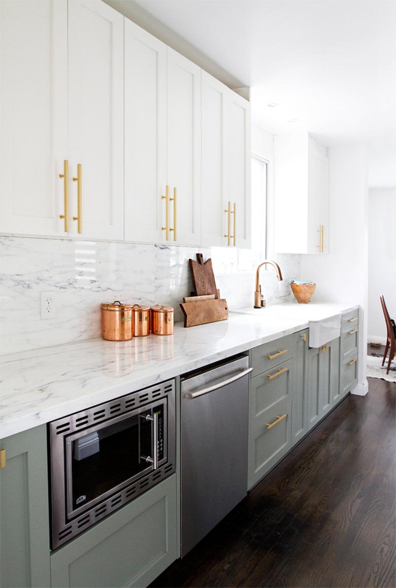 sage green and white two-tone kitchen