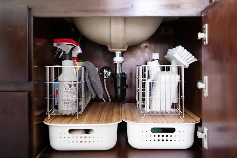 bathroom cleaning supplies under the sink