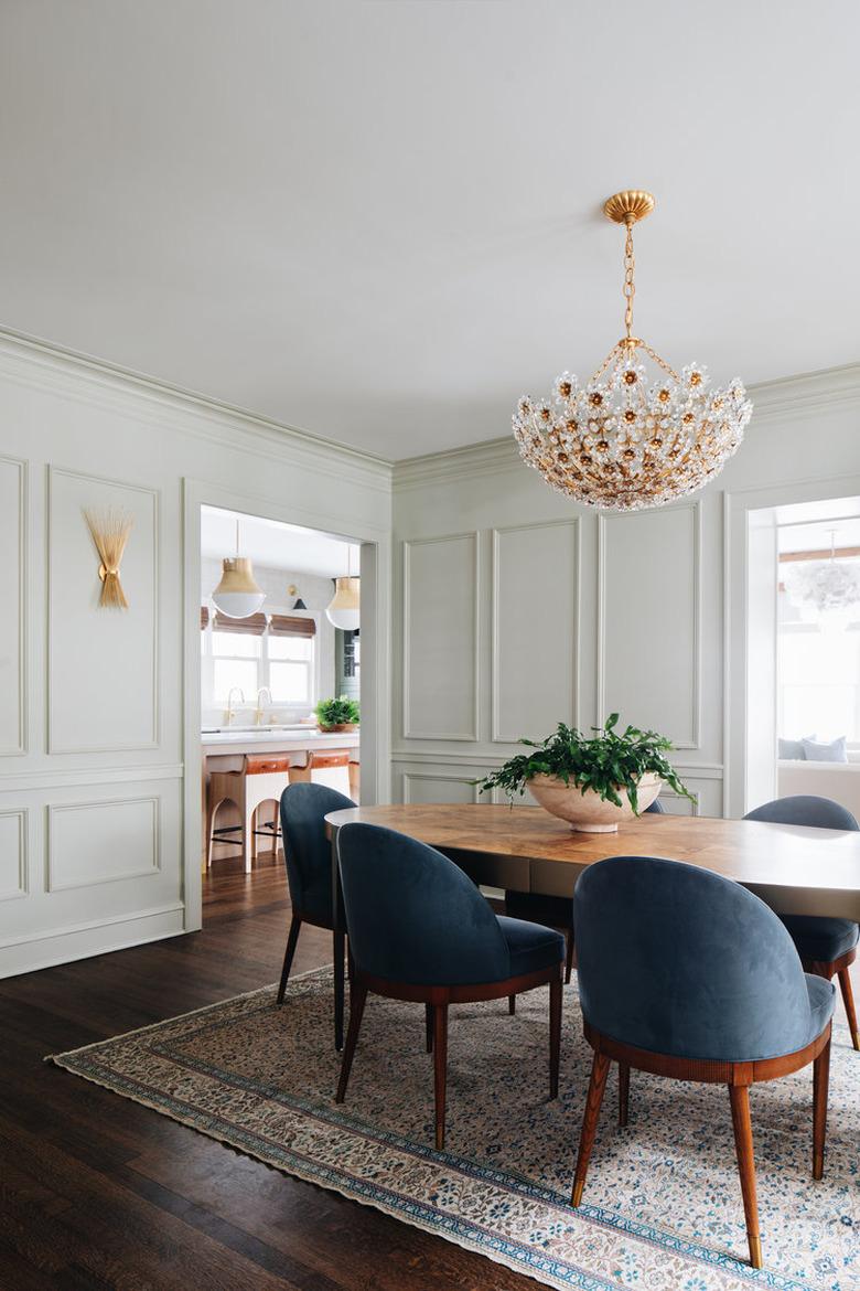 Dining room with dark brown wood floors and white walls