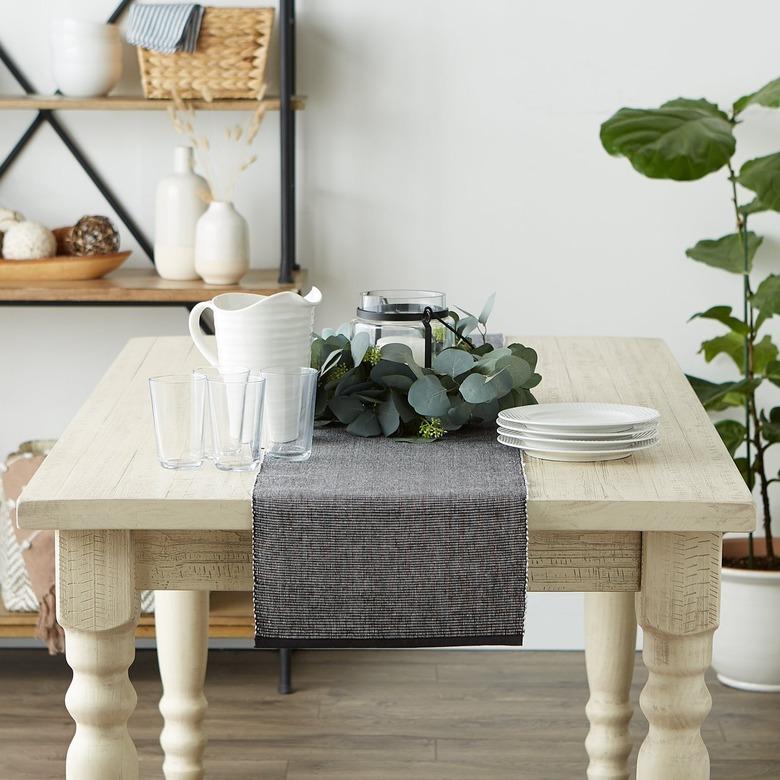 black and white table runner on wooden table