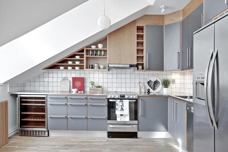 contemporary kitchen with stainless steel countertops and cabinet fronts