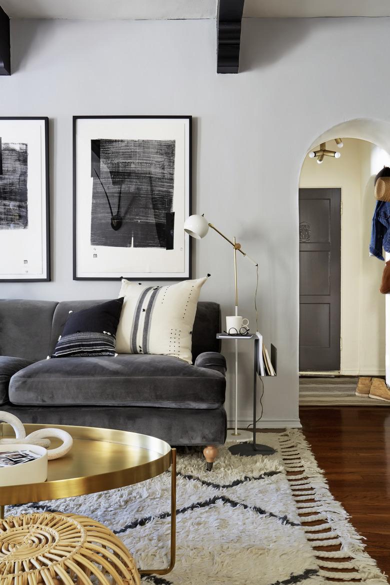 slate velvet sofa in gray living room