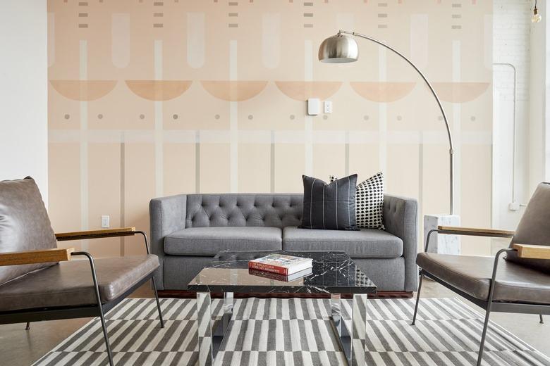 living room with gray couch and silver lamp