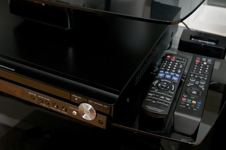 Home entertainment center with remote controls