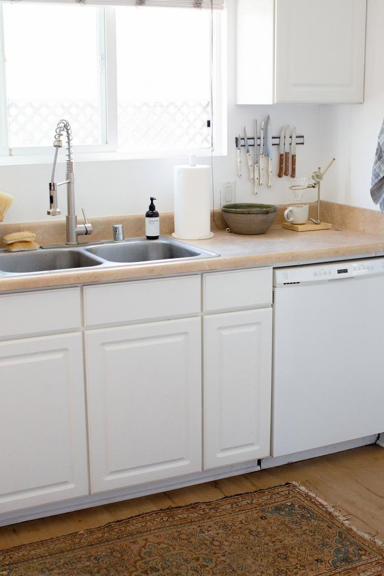 self-rimming sink in white kitchen