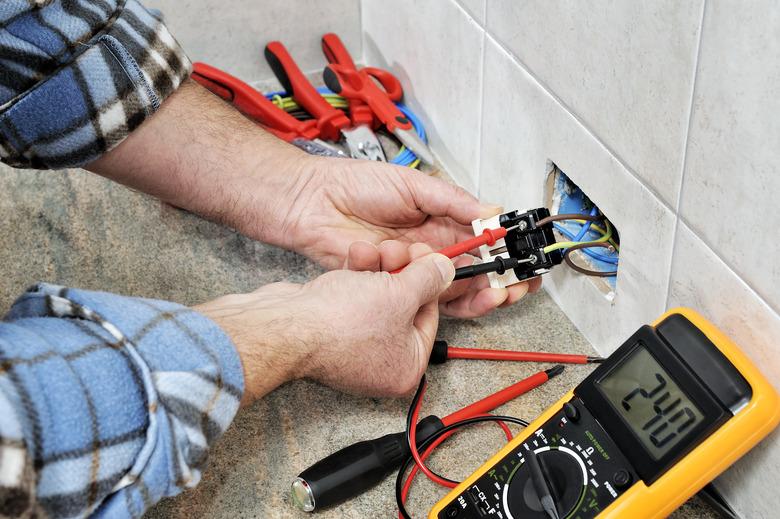 Electrician technician at work on a residential electric system.