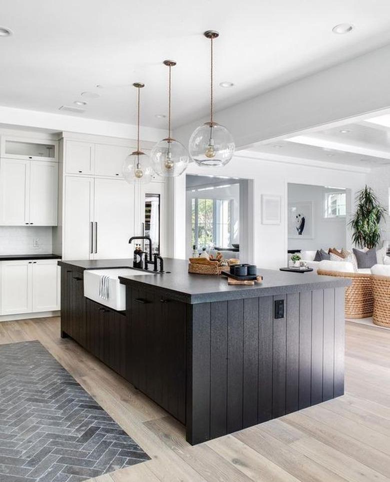 black kitchen island with black countertop