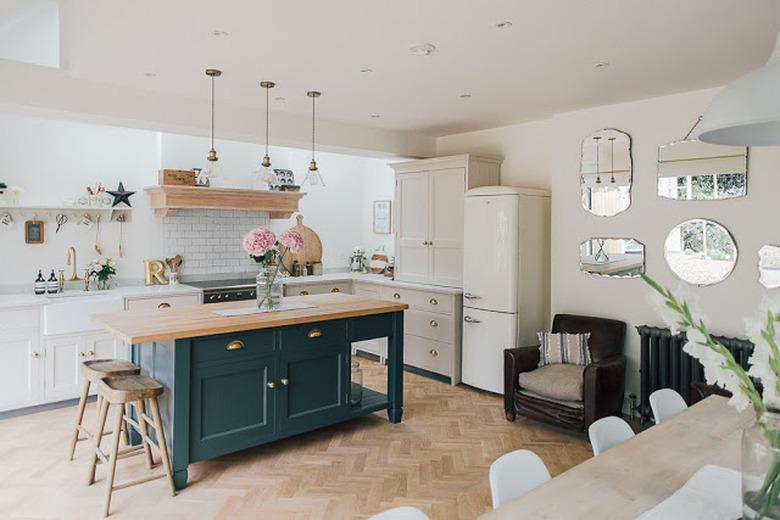 dark blue grey kitchen island with wooden countertop