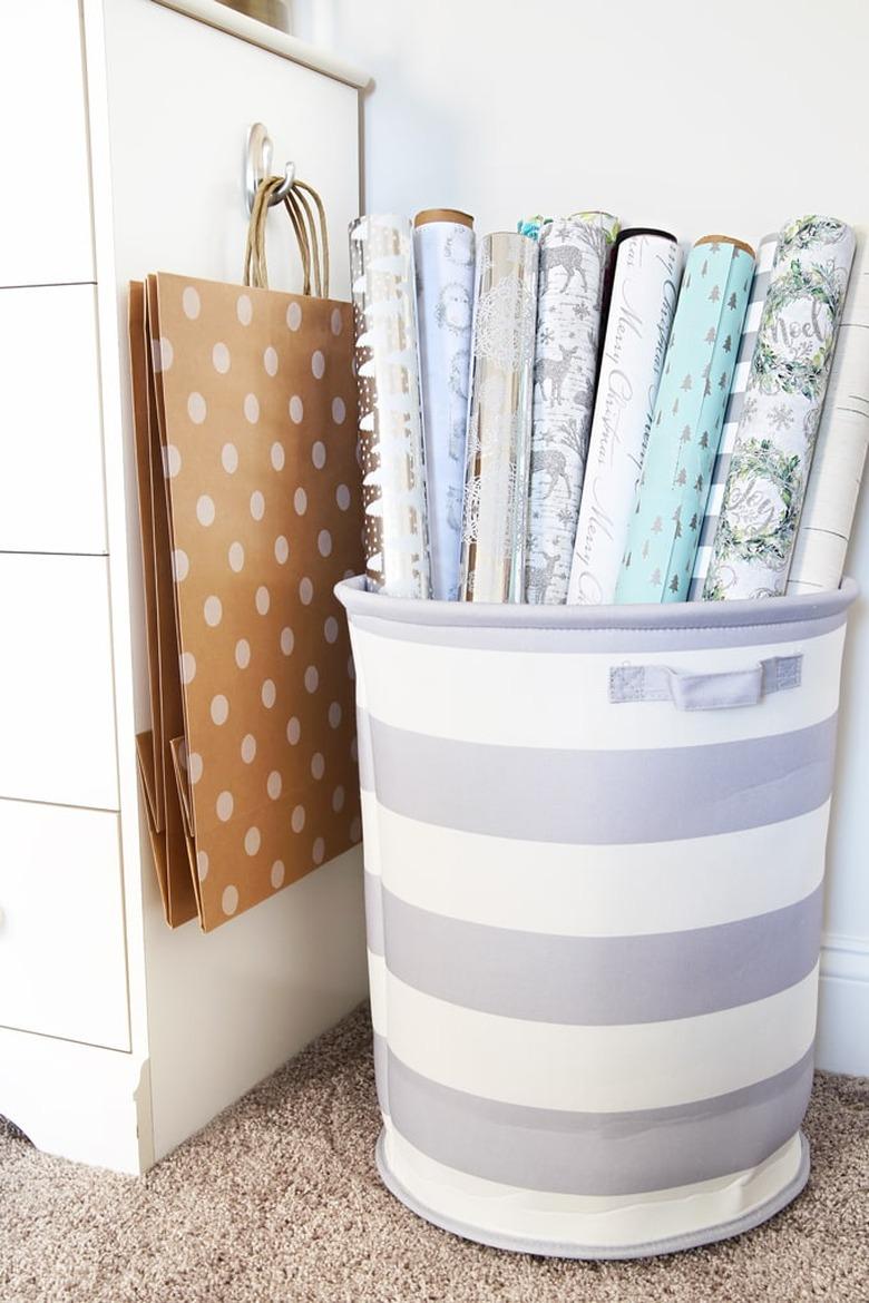 wrapping paper in striped laundry hamper