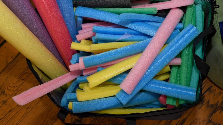 Colorful stack of pool noodles