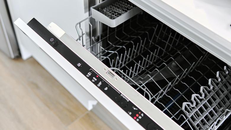 Open dishwasher showing top grate for loading