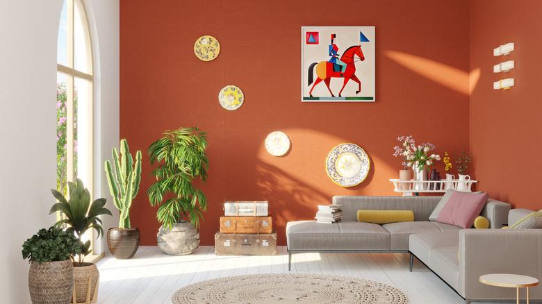 yellow decorative plates on an orange accent wall