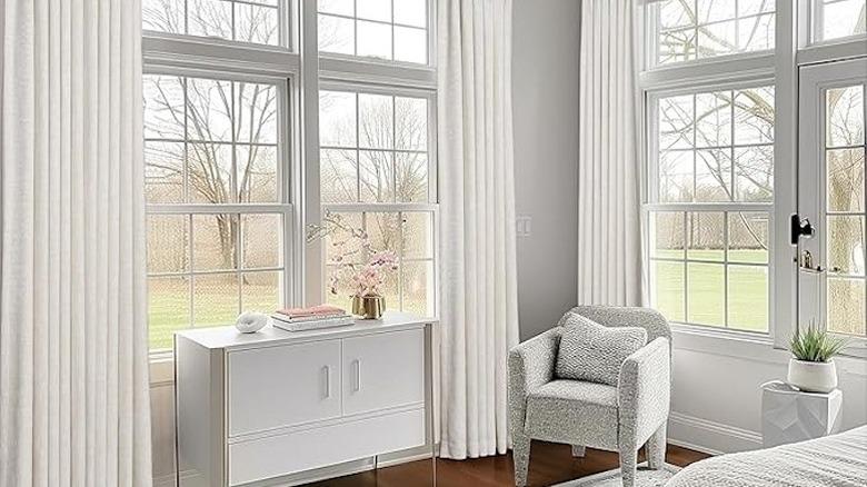 White linen curtains in bedroom