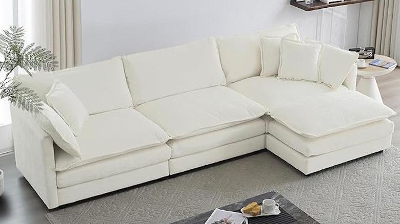 white sofa with chaise ottoman