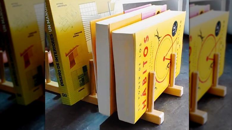 ikea ostbit plate holder used as a book holder