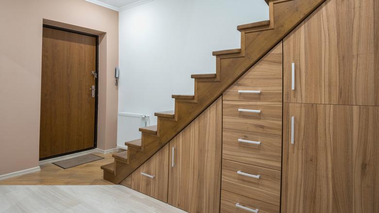 Wood cabinetry underneath staircase