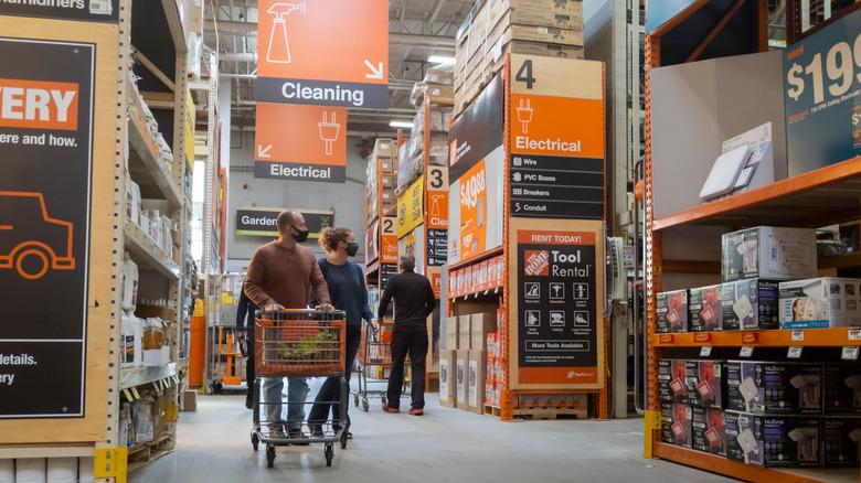 Customers browsing the aisles of a Home Depot store