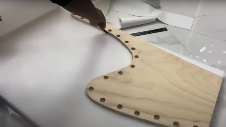tracing the side panel onto a piece of upholstery foam