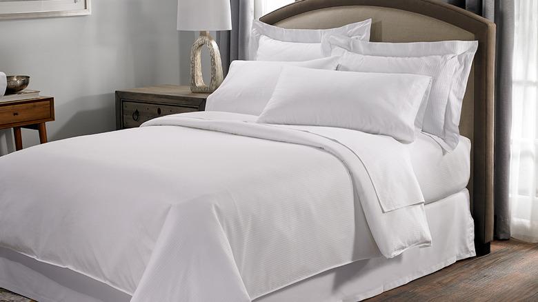 Hilton Hotel bed made up with white linens