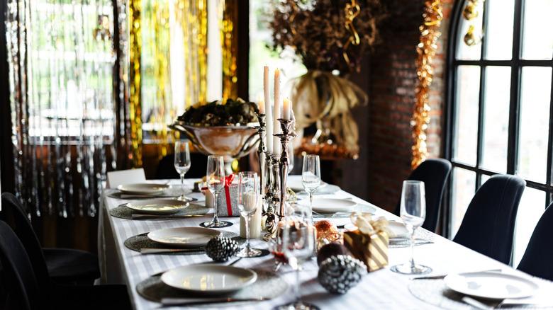 elegant dining table with silver and gold decor