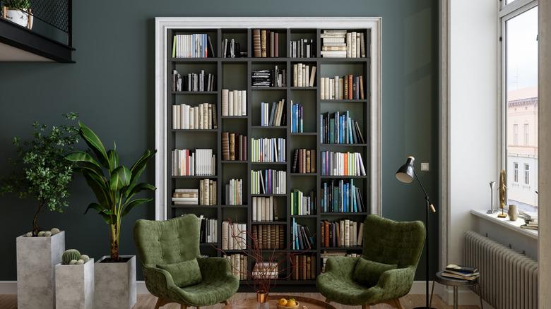 small in home library with chairs and other decor