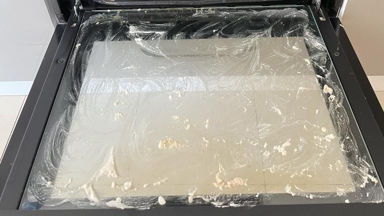 Baking soda paste on glass oven door