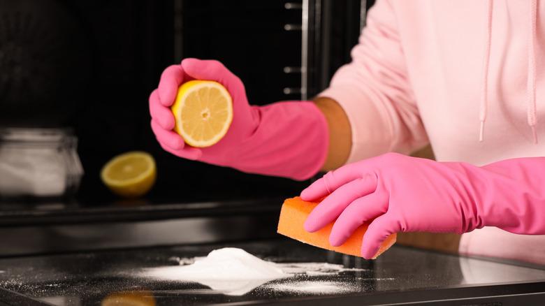 Cleaning oven door with salt and lemon halves