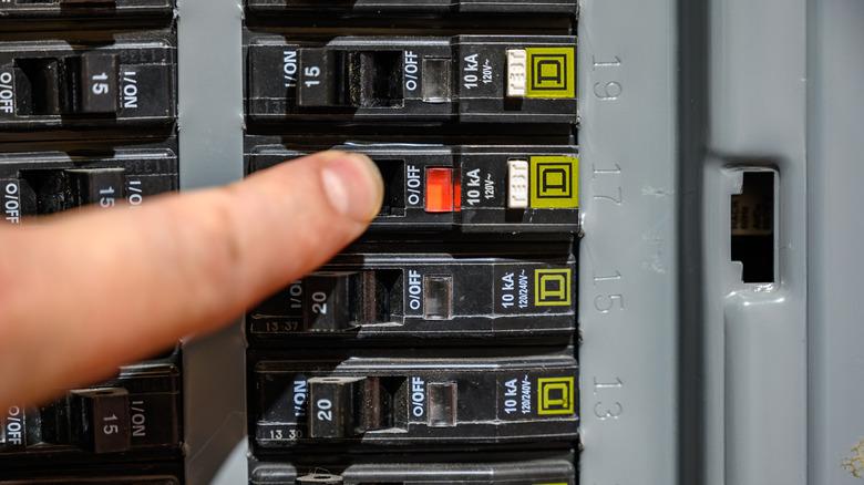 Finger resetting AFCI circuit breaker