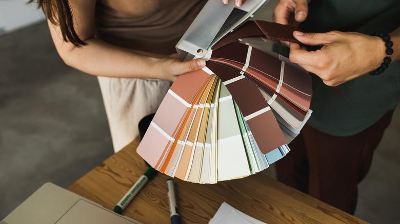 couple examining paint swatches