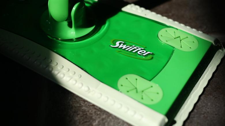 close up of Swiffer sweeper on tile floor