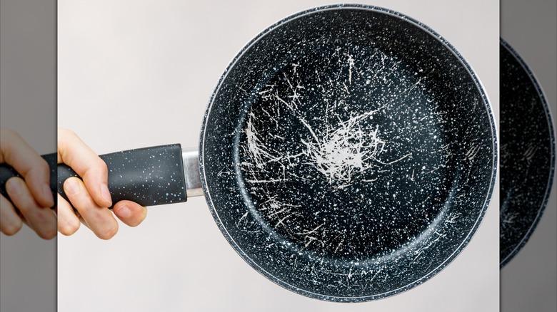 a scratched surface of a non-stick pan