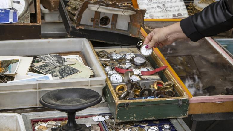 person looking at vintage watches