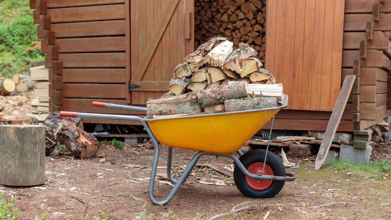 split firewood in a yellow wheelbarrow