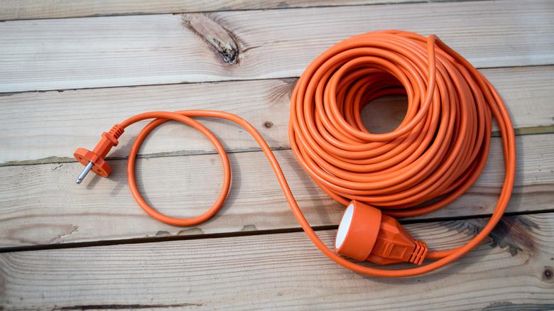 neatly coiled orange extension cord