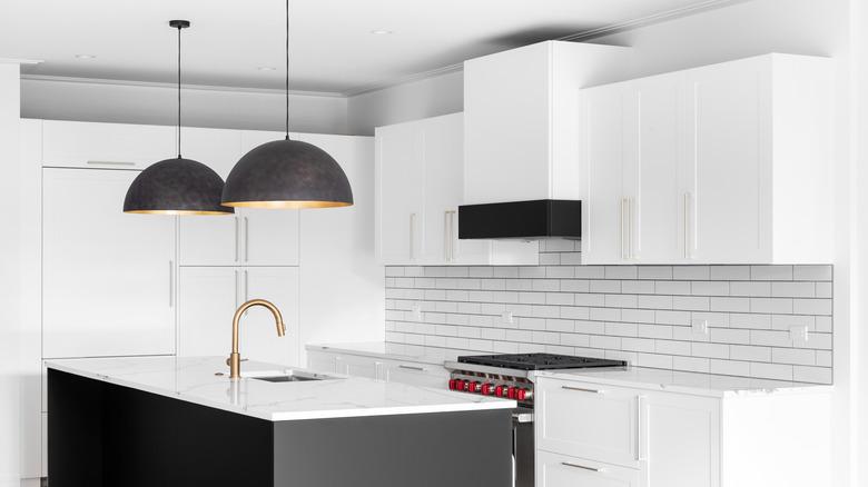 white kitchen with black island