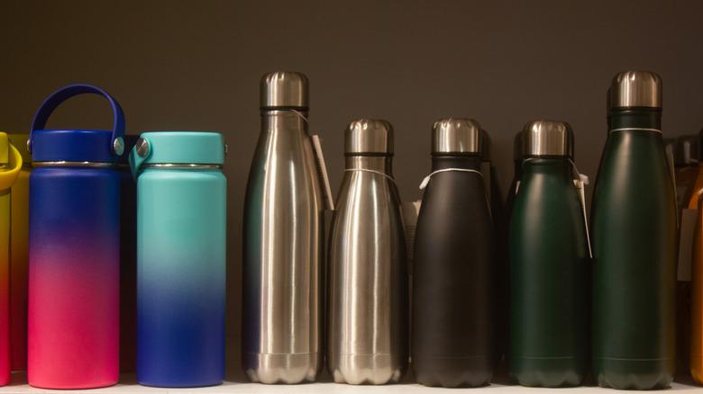 rows of reusable water bottles on a shelf