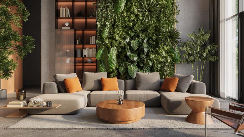 living room with a living plant wall behind the sofa