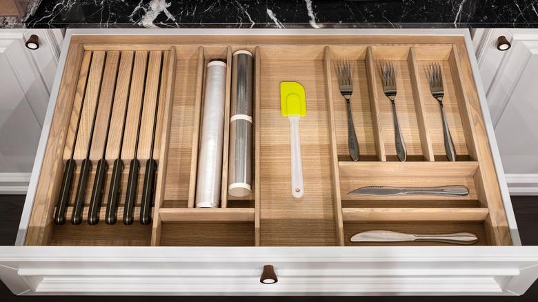 kitchen utensil organizer in an open drawer with utensils