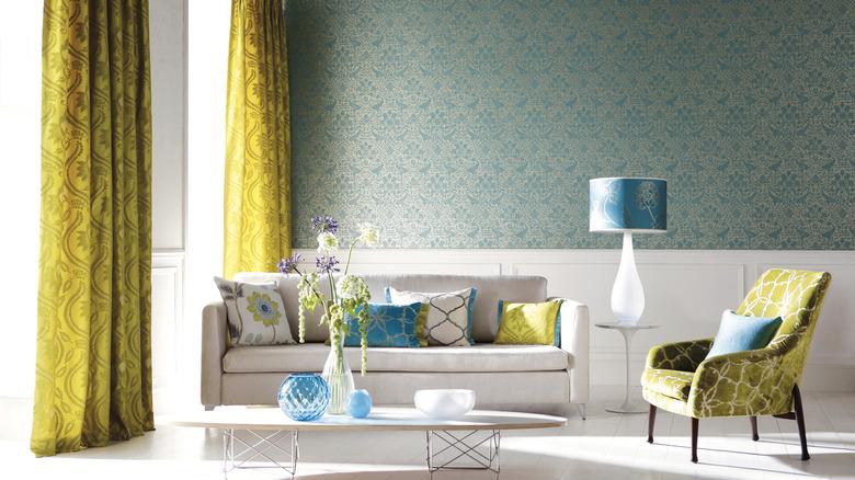 example of pattern mixing in living room with many different patterns made cohesive by color palette
