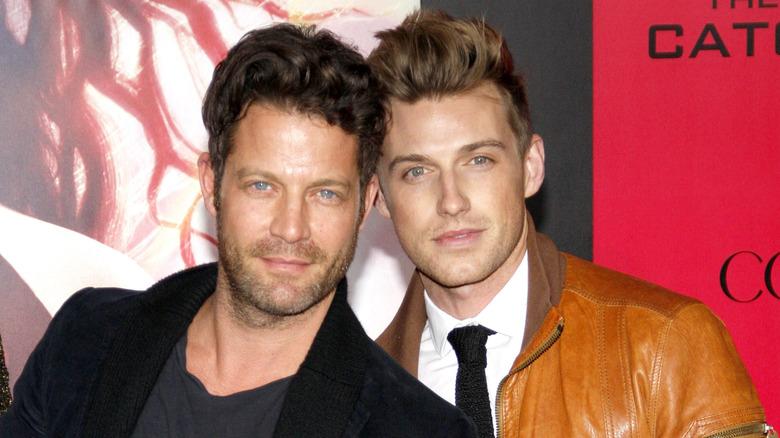 berkus and brent posing together at a red carpet event