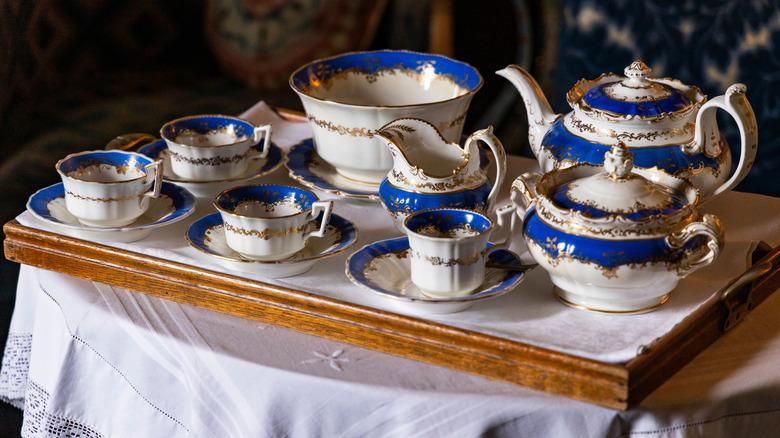 blue and white porcelain tea set on cart