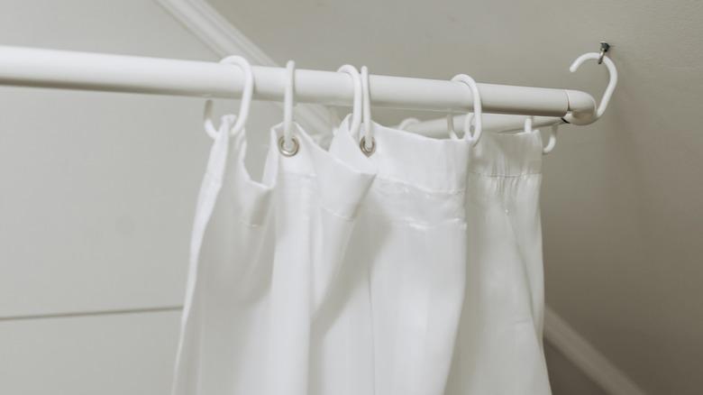 modern bathroom with white shower curtain