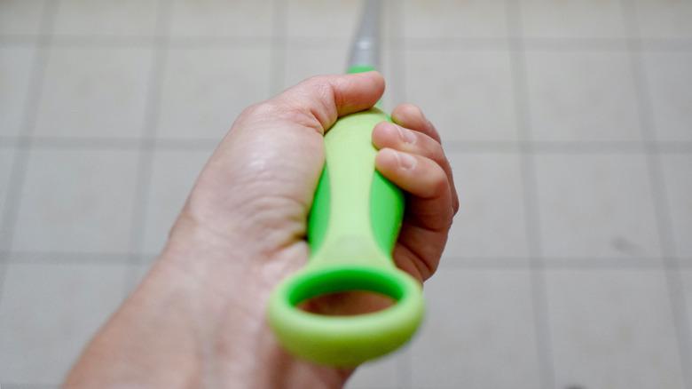 swiffer wiping down bathroom wall