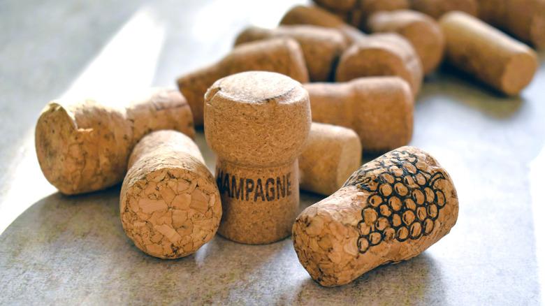 several wine corks laying together on a flat surface
