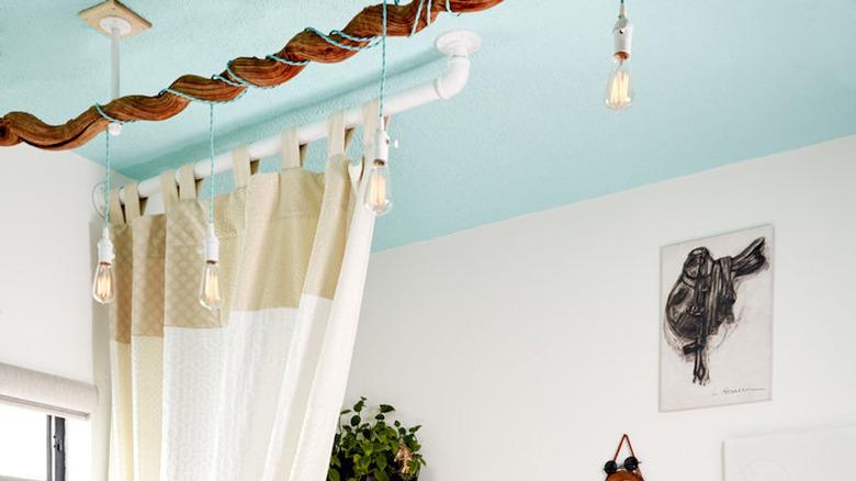 bedroom with turquoise ceiling