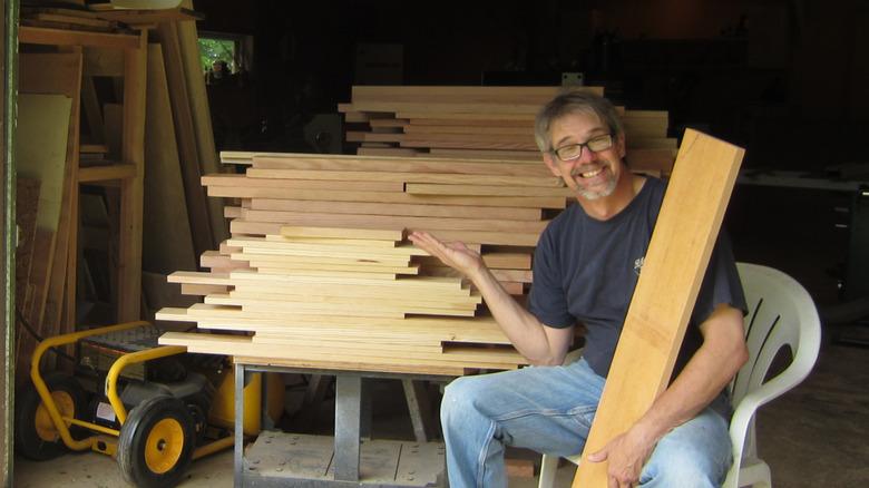 the author with a large pile of lumber