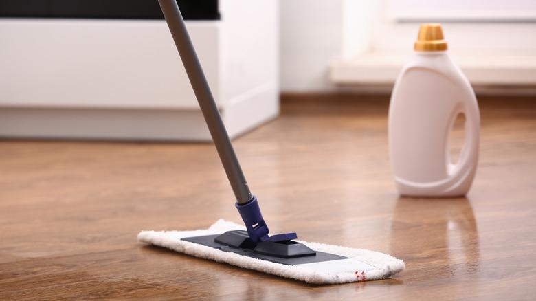 Dry mopping laminate floor with bottled cleaner