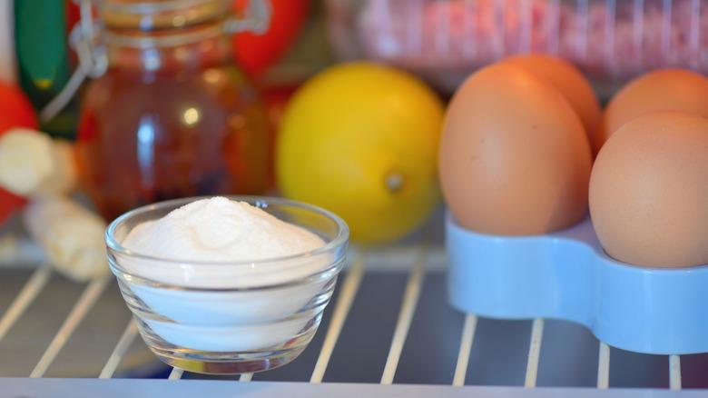 bowl of baking soda inside a fridge