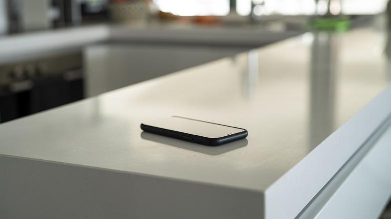 A phone charging on a counter seamlessly.